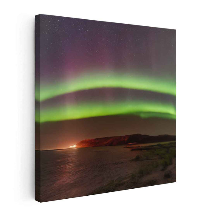 Celestial Serenity Encounters Calm Reflections: Captivating Northern Lights Over Tranquil Waters