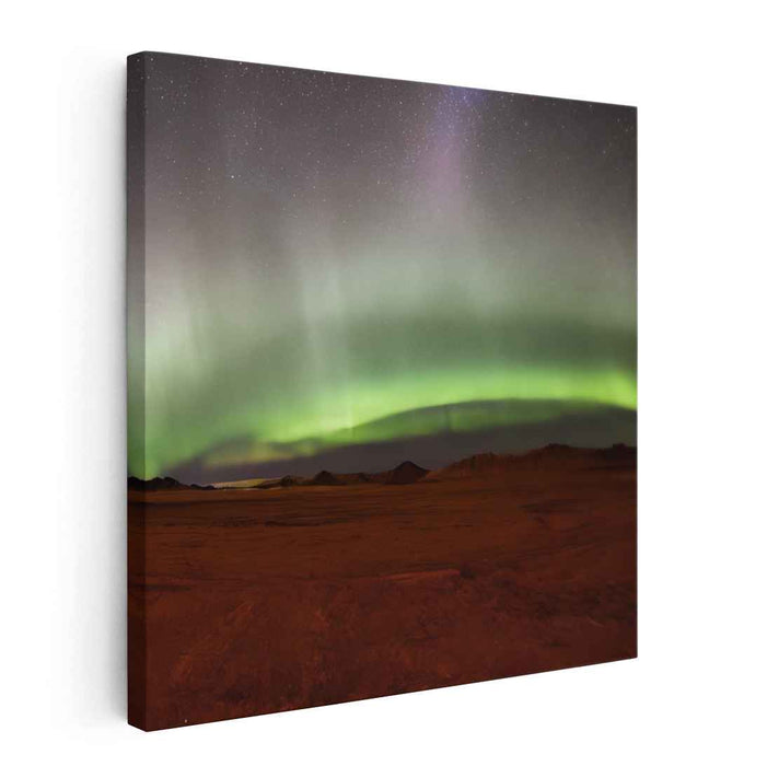 Ethereal Sandstorm Glow: Aurora Borealis Over Desert Landscape Canvas Art Print
