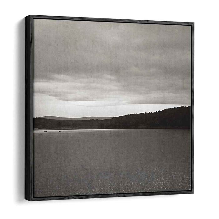 Slate Waterside Drama: Monochrome Landscape of Serene Waters and Brooding Skies