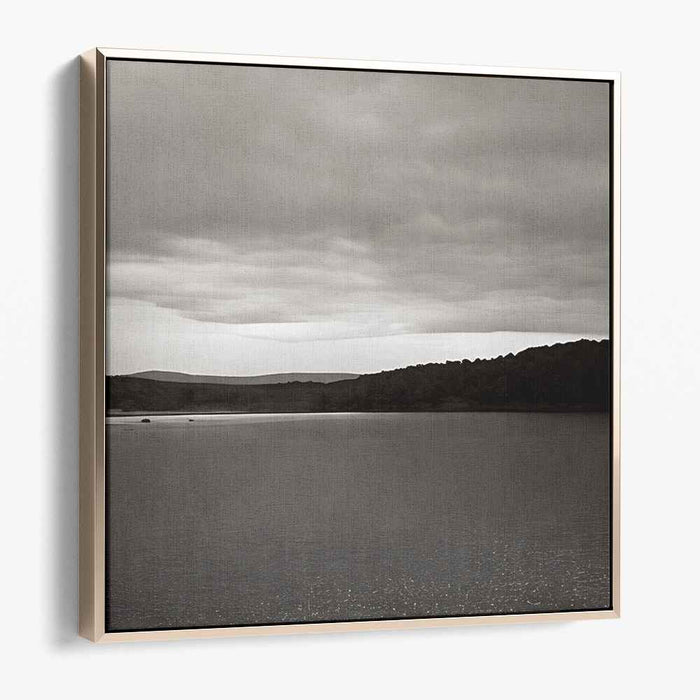Slate Waterside Drama: Monochrome Landscape of Serene Waters and Brooding Skies
