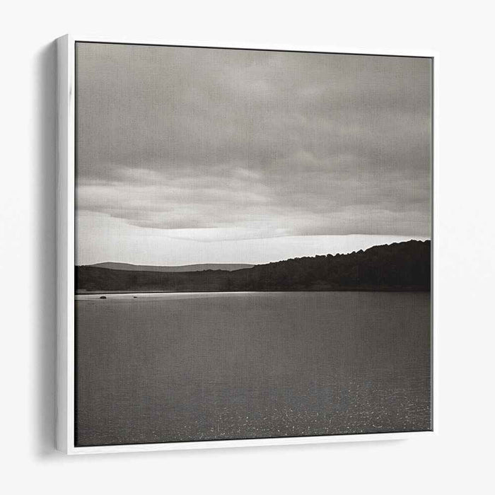 Slate Waterside Drama: Monochrome Landscape of Serene Waters and Brooding Skies