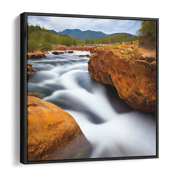 Ripple Dance Among Stone Giants: Serene River Flowing Through Rugged Terrain