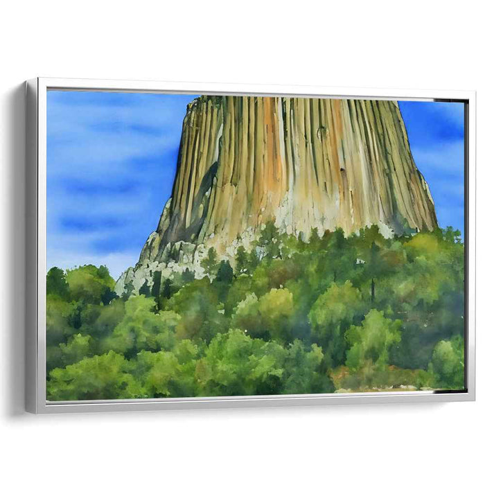 Echoing Heights Among Green Canopy: Towering Rock Formation Over Verdant Forest